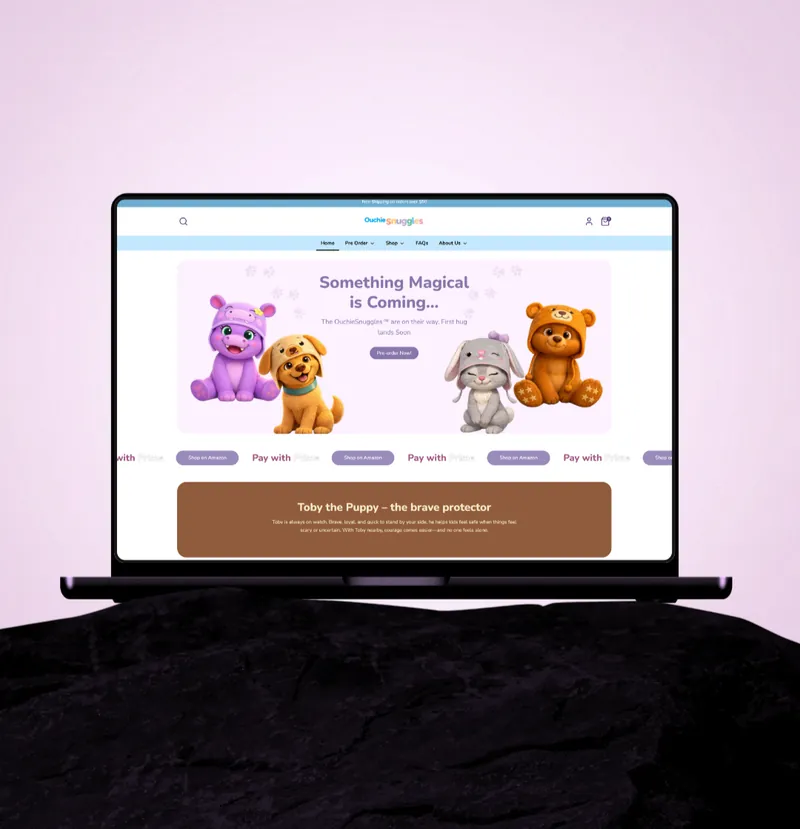 The OuchieCap Shopify storefront on a laptop