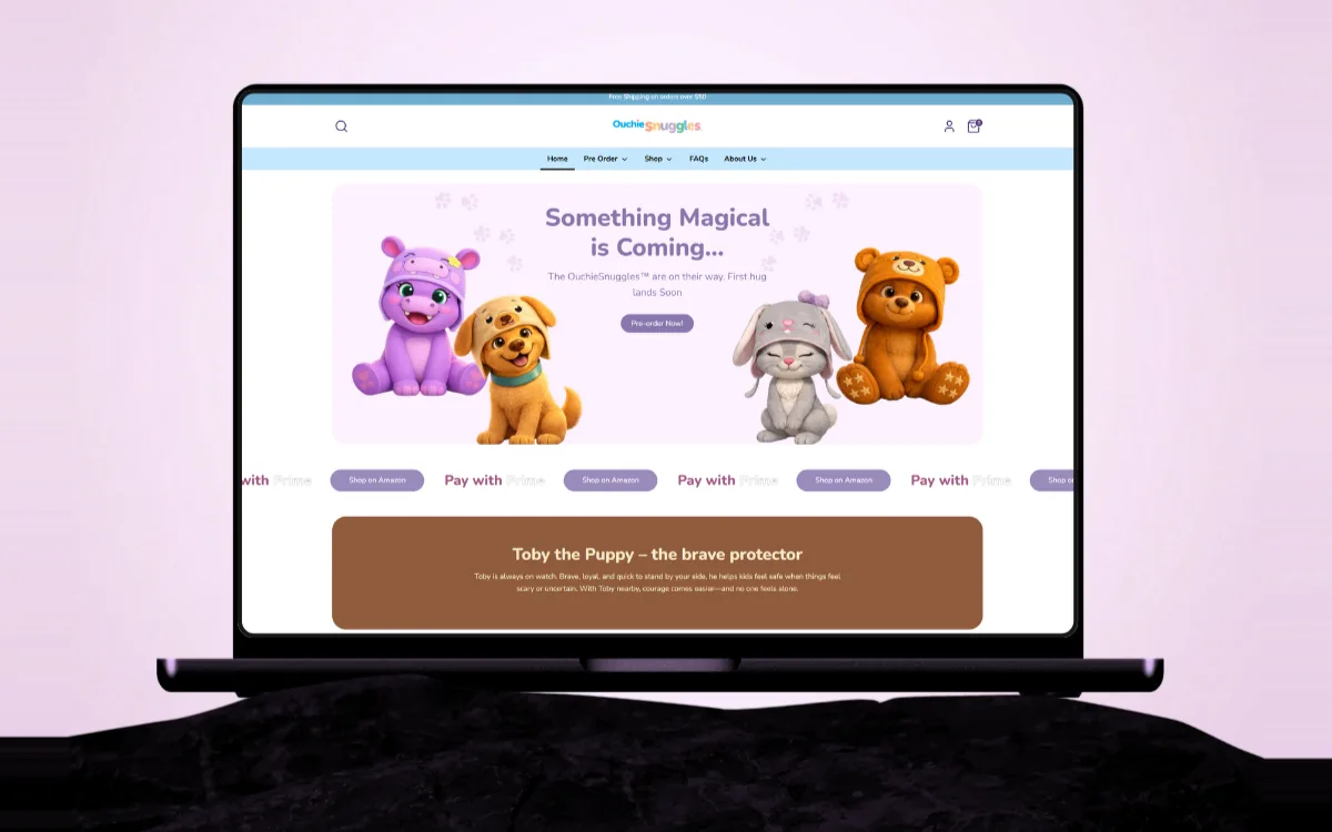 The OuchieSnuggles launch page on a laptop